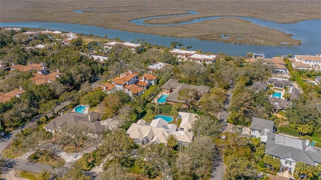 drone / aerial view with a water view and a residential view