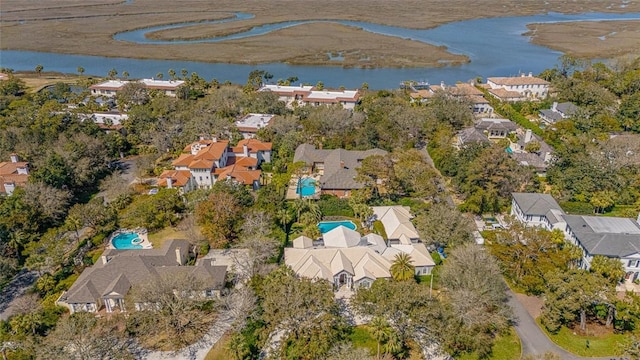 drone / aerial view featuring a residential view and a water view