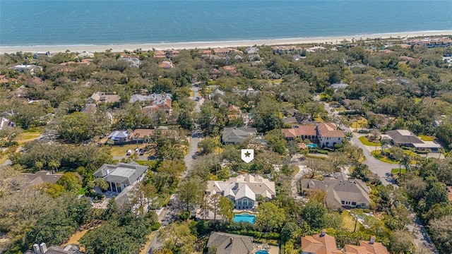 aerial view with a beach view, a water view, and a residential view