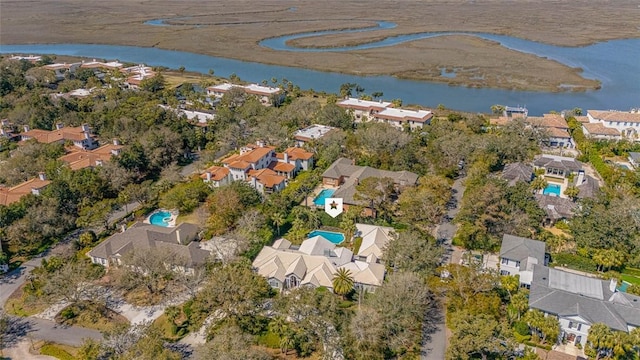 drone / aerial view featuring a residential view and a water view