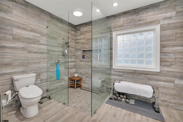 189 Harbor Pointe Dr, Brunswick, GA 31523 - full bath featuring toilet, walk in shower, tile walls, wood finished floors, and recessed lighting