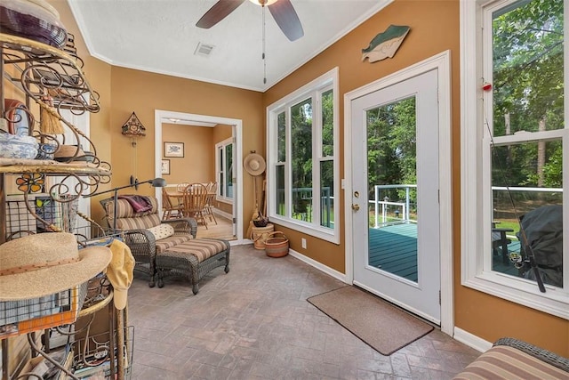 189 Harbor Pointe Dr, Brunswick, GA 31523 - sunroom with healthy amount of natural light, baseboards, ornamental molding, and brick patterned flooring