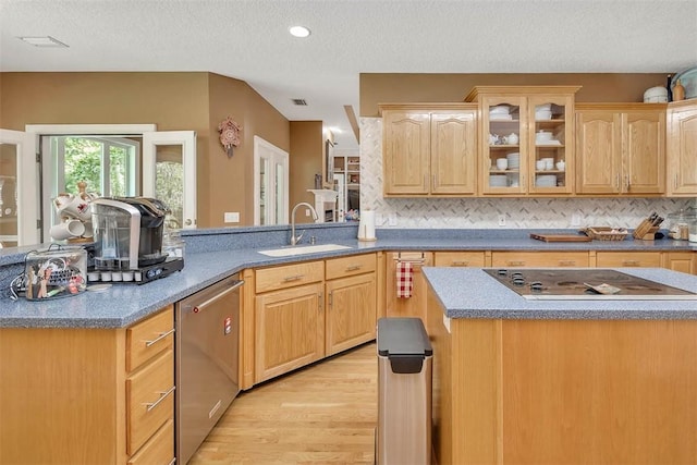 189 Harbor Pointe Dr, Brunswick, GA 31523 - kitchen featuring a sink, dishwasher, black electric cooktop, light wood-style floors, and a textured ceiling