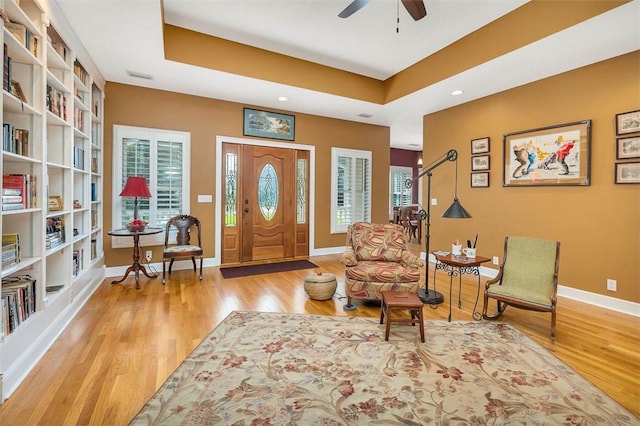 189 Harbor Pointe Dr, Brunswick, GA 31523 - entrance foyer featuring wood finished floors, a ceiling fan, baseboards, a tray ceiling, and recessed lighting