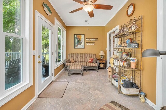 189 Harbor Pointe Dr, Brunswick, GA 31523 - living area featuring ceiling fan, brick flooring, crown molding, and baseboards