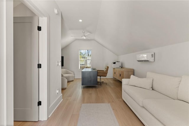 living room with ceiling fan, vaulted ceiling, and light hardwood / wood-style flooring