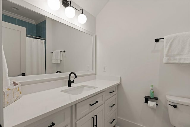 bathroom featuring a shower with shower curtain, vanity, toilet, and ornamental molding