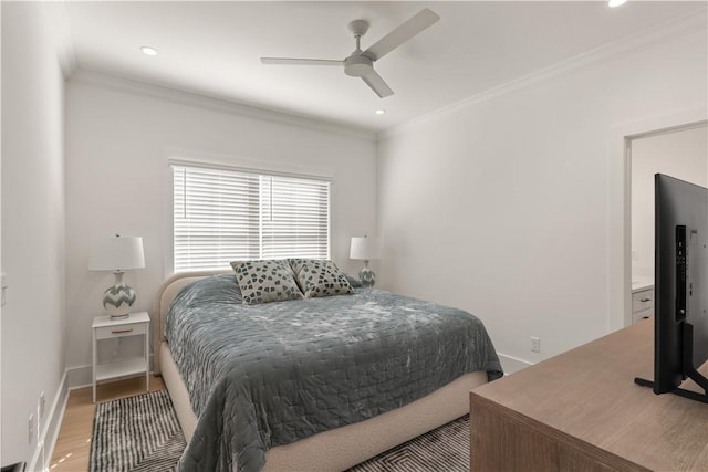 bedroom with ceiling fan, crown molding, and wood-type flooring