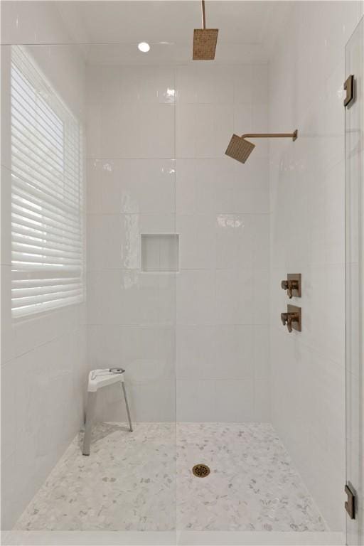 bathroom featuring a shower with shower door