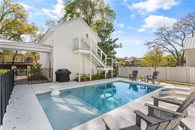 view of pool featuring area for grilling