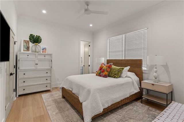 bedroom with a closet, ceiling fan, light hardwood / wood-style flooring, and ornamental molding