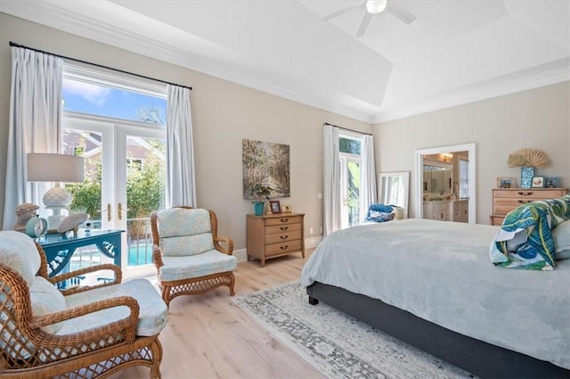 bedroom featuring french doors, ensuite bath, ceiling fan, crown molding, and light hardwood / wood-style floors