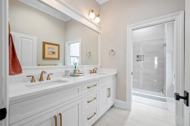 bathroom featuring vanity and a shower with door