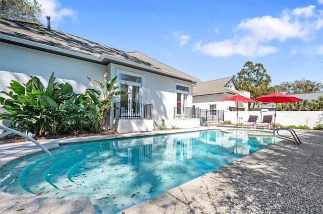 view of swimming pool with a patio