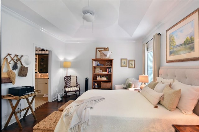 1902 Mariners Cir, Saint Simons Island, GA 31522 - bedroom featuring a tray ceiling, dark wood-style floors, crown molding, and ensuite bathroom