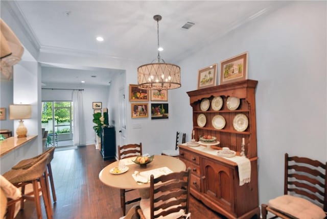 1902 Mariners Cir, Saint Simons Island, GA 31522 - dining area featuring crown molding, dark wood-style flooring, a chandelier, and recessed lighting