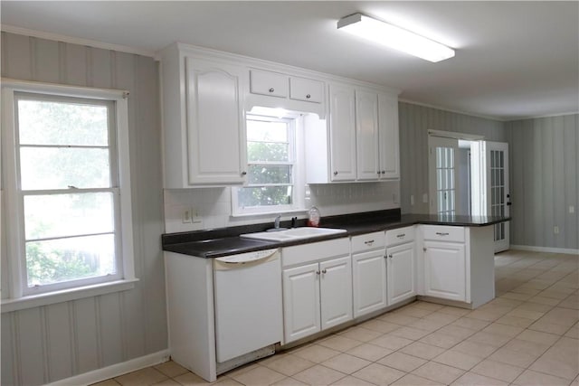 695 Lanes Bridge Rd, Jesup, GA 31545 - kitchen with white dishwasher, a sink, a peninsula, dark countertops, and crown molding