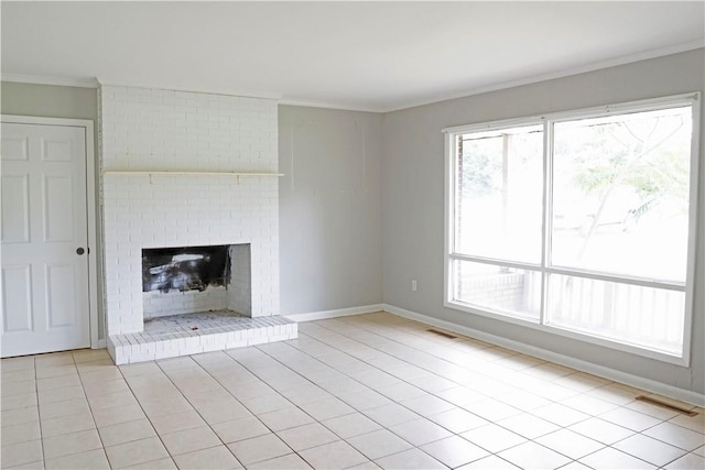 695 Lanes Bridge Rd, Jesup, GA 31545 - unfurnished living room featuring ornamental molding, a fireplace, light tile patterned floors, and baseboards