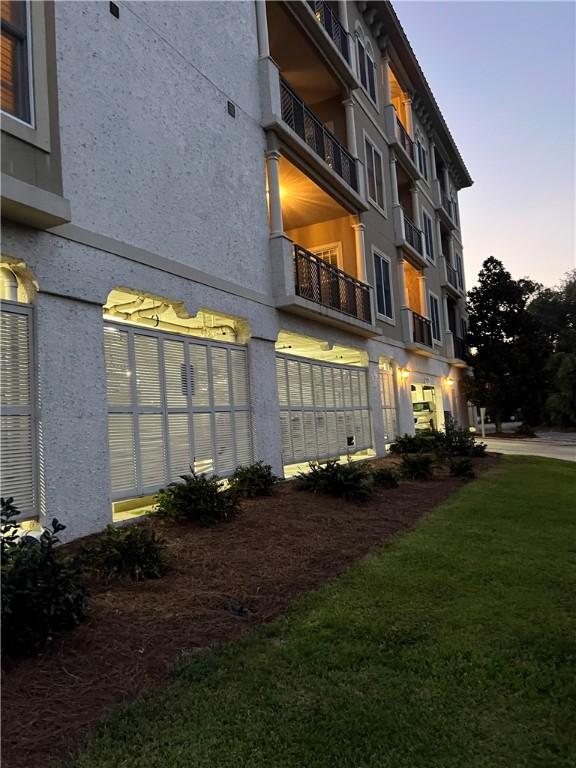 view of outdoor building at dusk