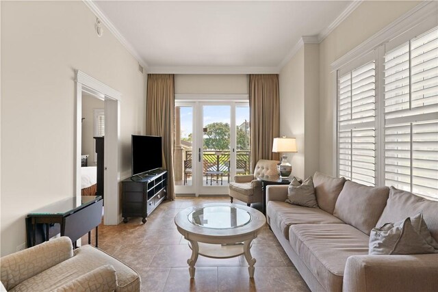 living room with light tile patterned floors and ornamental molding