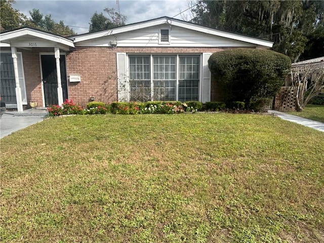 view of property exterior with a lawn