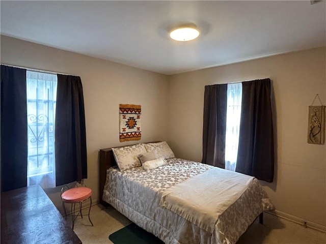 bedroom featuring light colored carpet