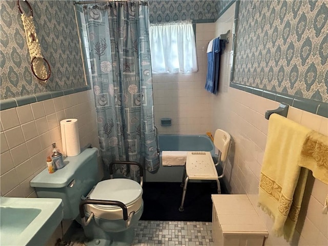 bathroom featuring shower / tub combo, tile walls, and toilet