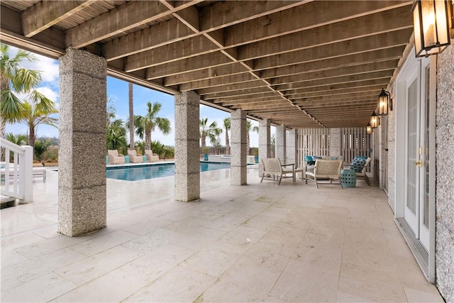 view of patio with an outdoor pool