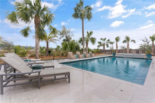 view of swimming pool featuring a patio area, fence, and a fenced in pool