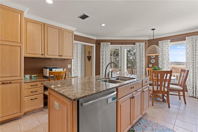 kitchen featuring stone counters, dishwasher, sink, hanging light fixtures, and a kitchen island with sink