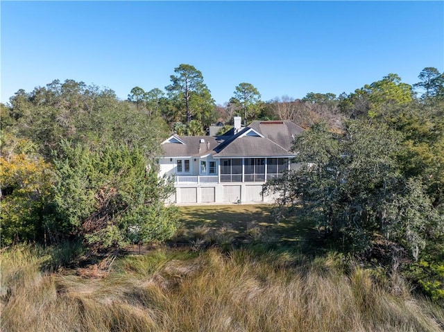 back of property featuring a sunroom