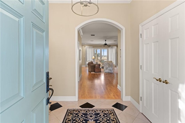 foyer entrance featuring ceiling fan and light tile patterned floors