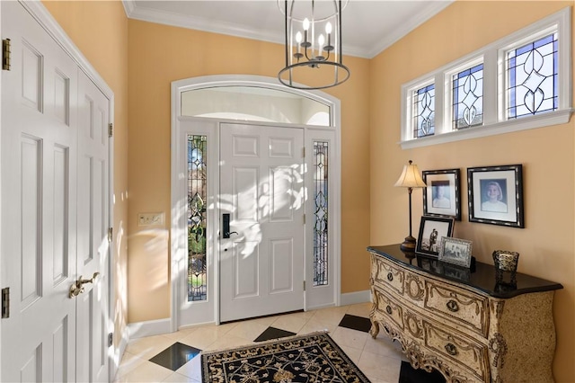 entryway with crown molding, light tile patterned floors, and a chandelier