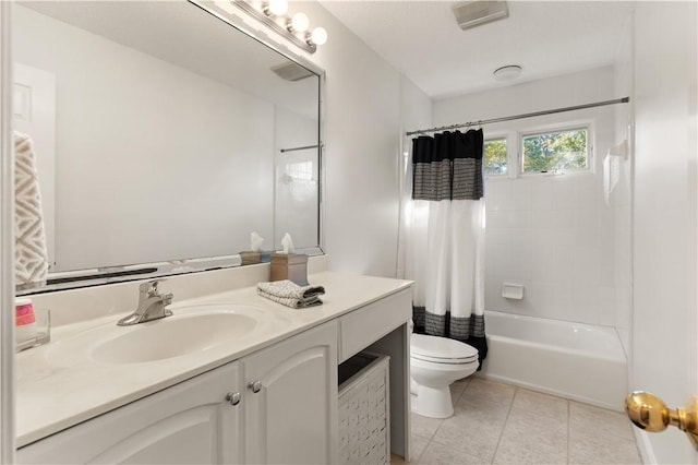 full bathroom featuring shower / tub combo with curtain, vanity, tile patterned floors, and toilet