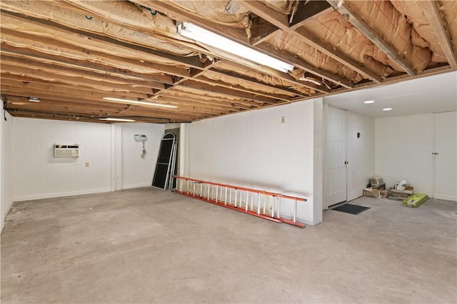 basement with a wall mounted AC