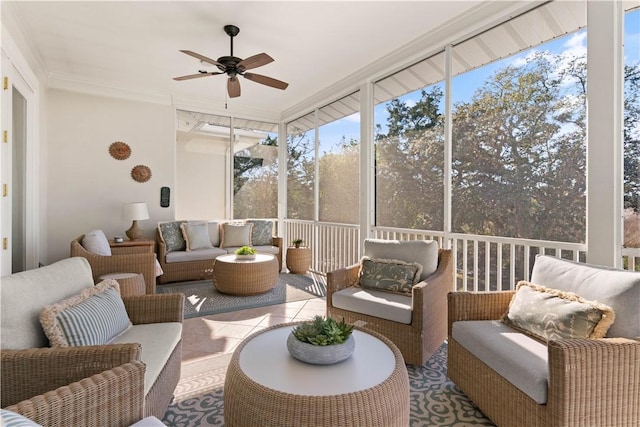 sunroom / solarium featuring ceiling fan