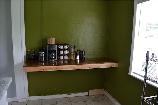 1308 Dean Dr, Waycross, GA 31501 - bar featuring plenty of natural light and light tile patterned floors