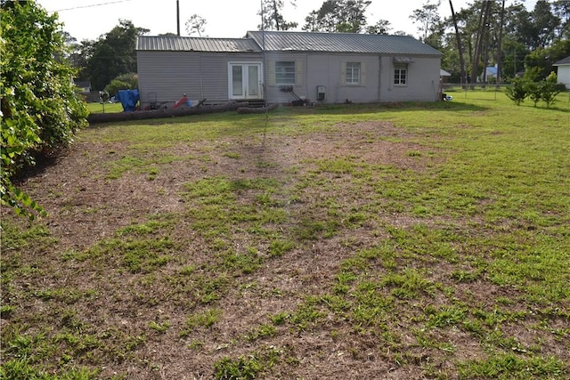 1308 Dean Dr, Waycross, GA 31501 - rear view of house featuring a metal roof