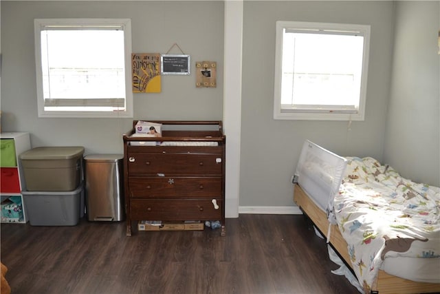 1308 Dean Dr, Waycross, GA 31501 - bedroom with dark wood-type flooring and baseboards