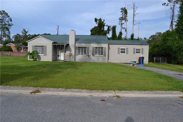 1308 Dean Dr, Waycross, GA 31501 - single story home featuring a chimney and a metal roof