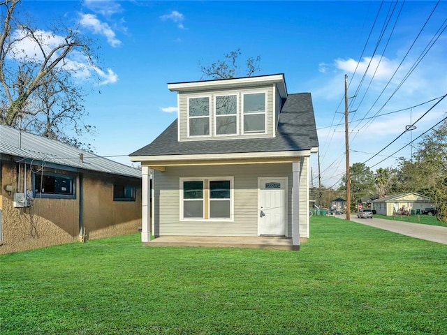 back of house featuring a yard