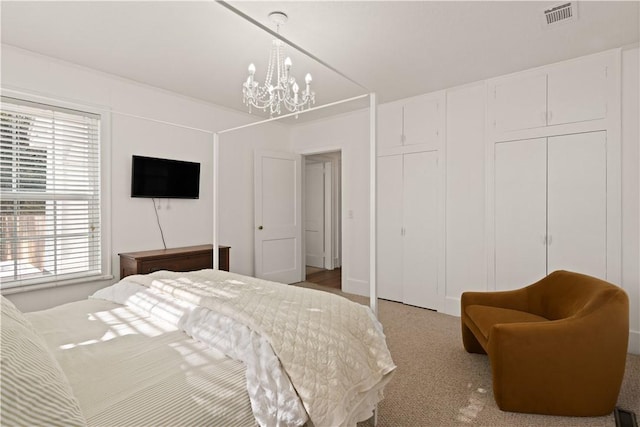 bedroom featuring a notable chandelier