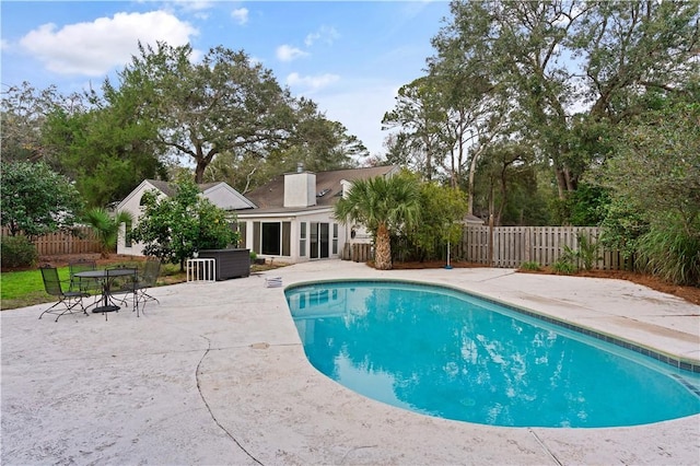 view of swimming pool featuring a patio