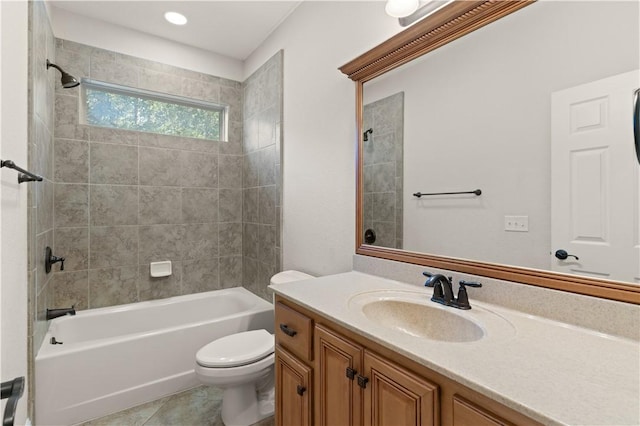 full bathroom with tile patterned flooring, vanity, toilet, and tiled shower / bath