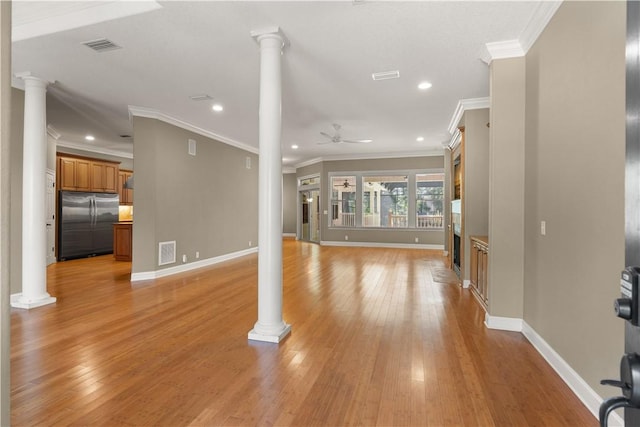 unfurnished living room with ornate columns, ceiling fan, light hardwood / wood-style flooring, and crown molding