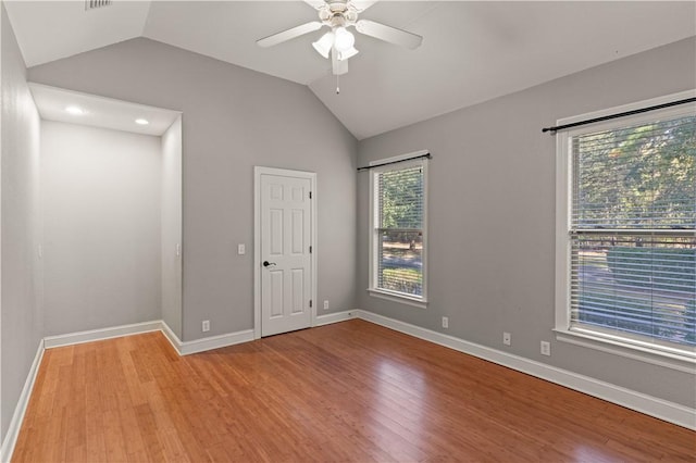 unfurnished room with light hardwood / wood-style flooring, ceiling fan, and lofted ceiling