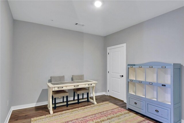 miscellaneous room with dark hardwood / wood-style floors