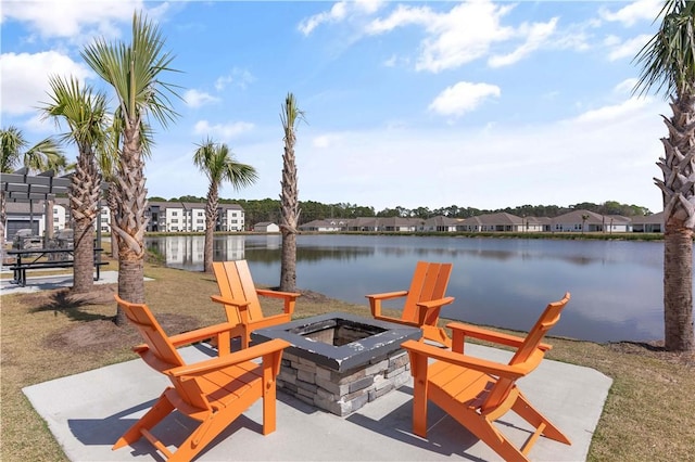 view of patio / terrace featuring a water view and an outdoor fire pit