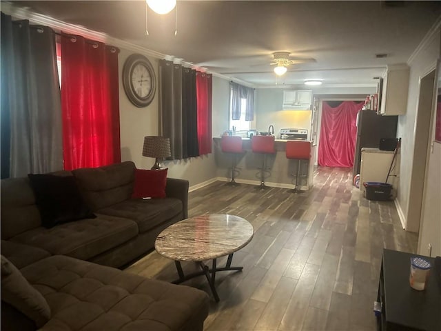 2627 Cleburne St, Brunswick, GA 31520 - living area with a ceiling fan, wood finished floors, crown molding, and baseboards