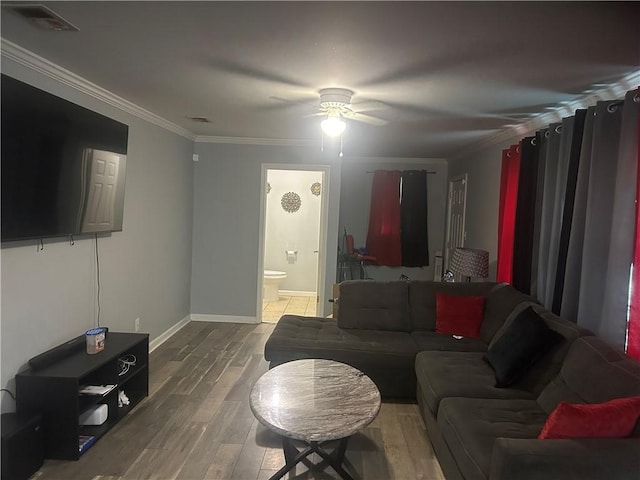 2627 Cleburne St, Brunswick, GA 31520 - living area featuring ceiling fan, wood finished floors, ornamental molding, and baseboards